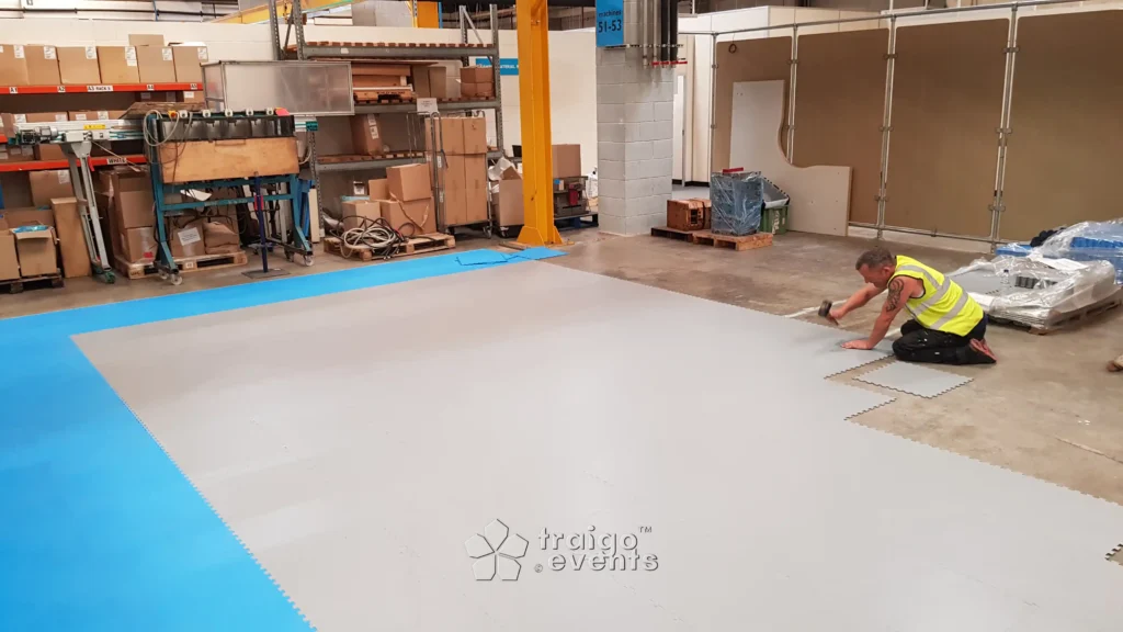 tough heavy duty indoor protective flooring being installed